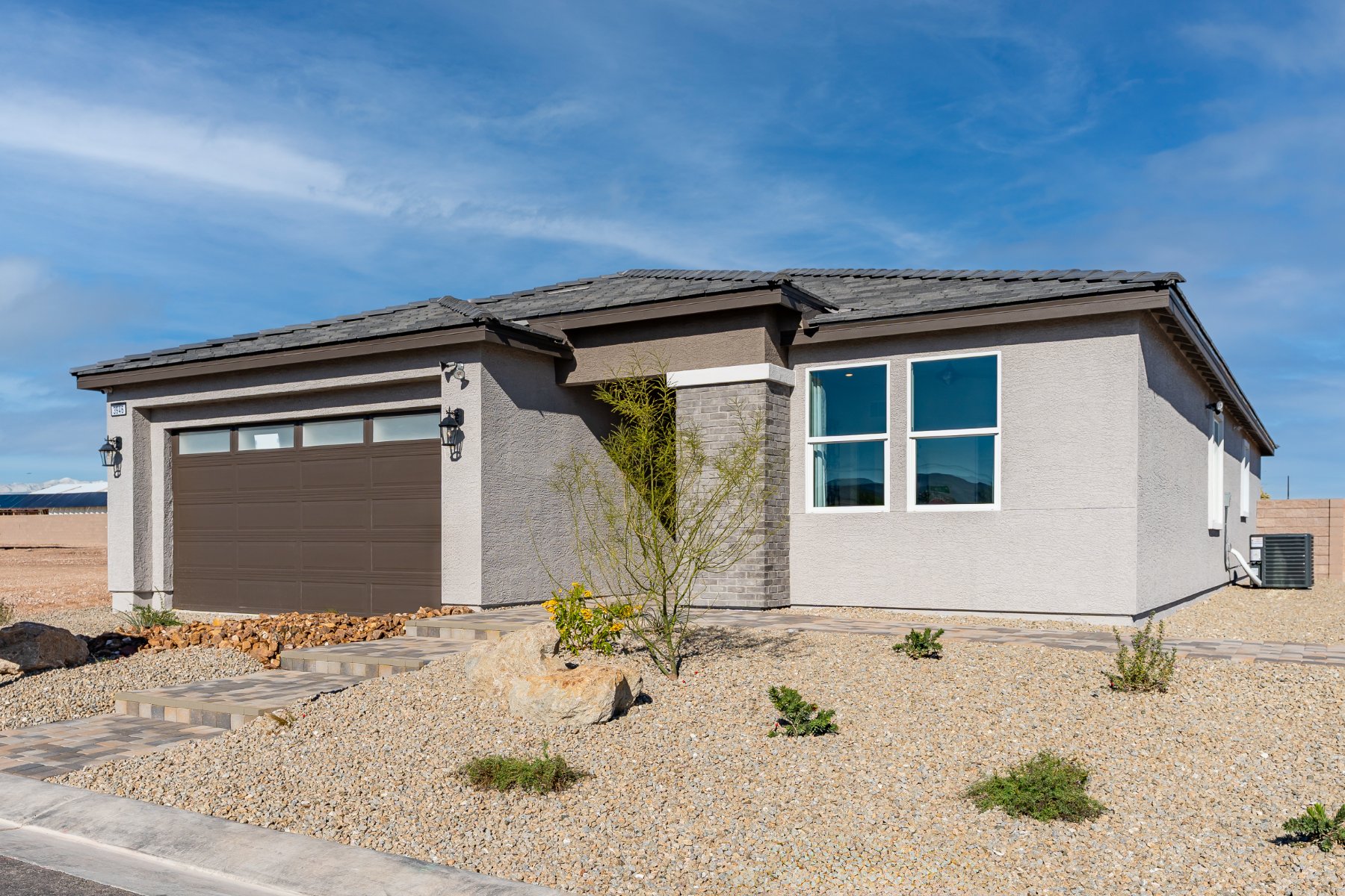 Beazer Homes Marigold community, single-story home at dusk